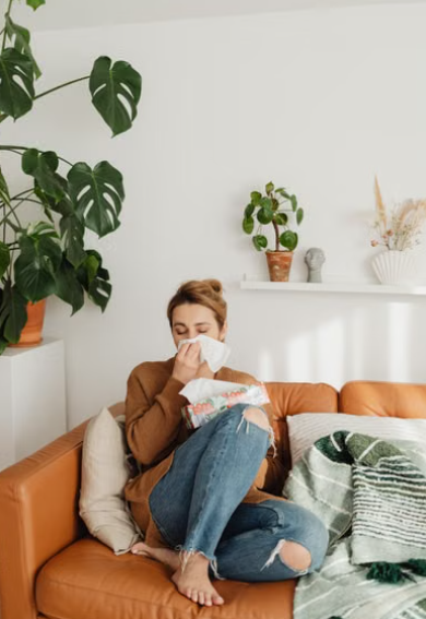 A family member observes a sick adult’s breathing symptoms while keeping a phone ready for help.